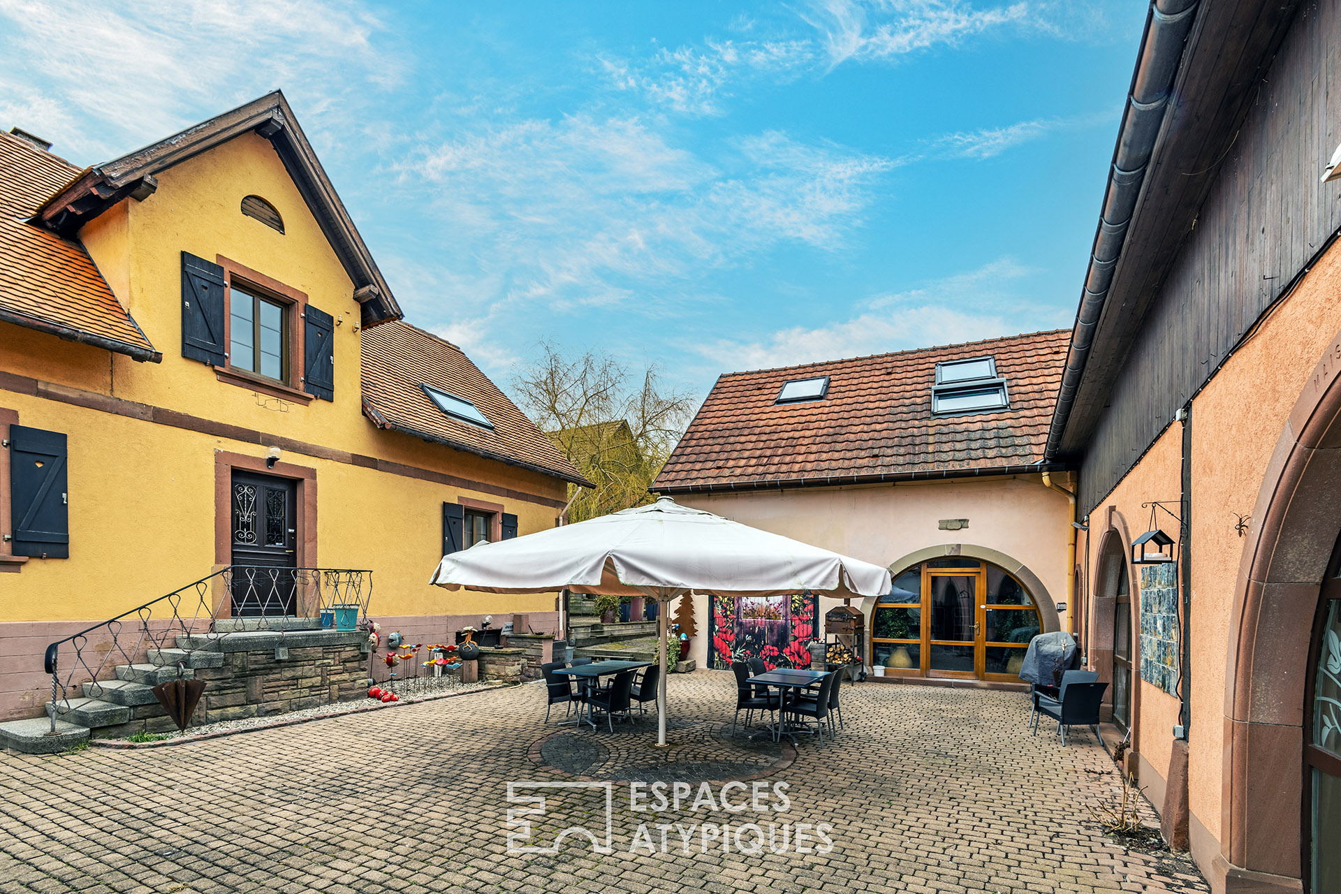 Renovated farmhouse and its guest rooms