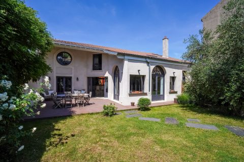 Former school revisited into a house with terrace and garden