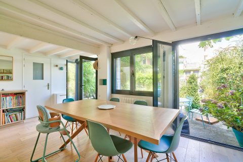 House on courtyard in a former fraying warehouse