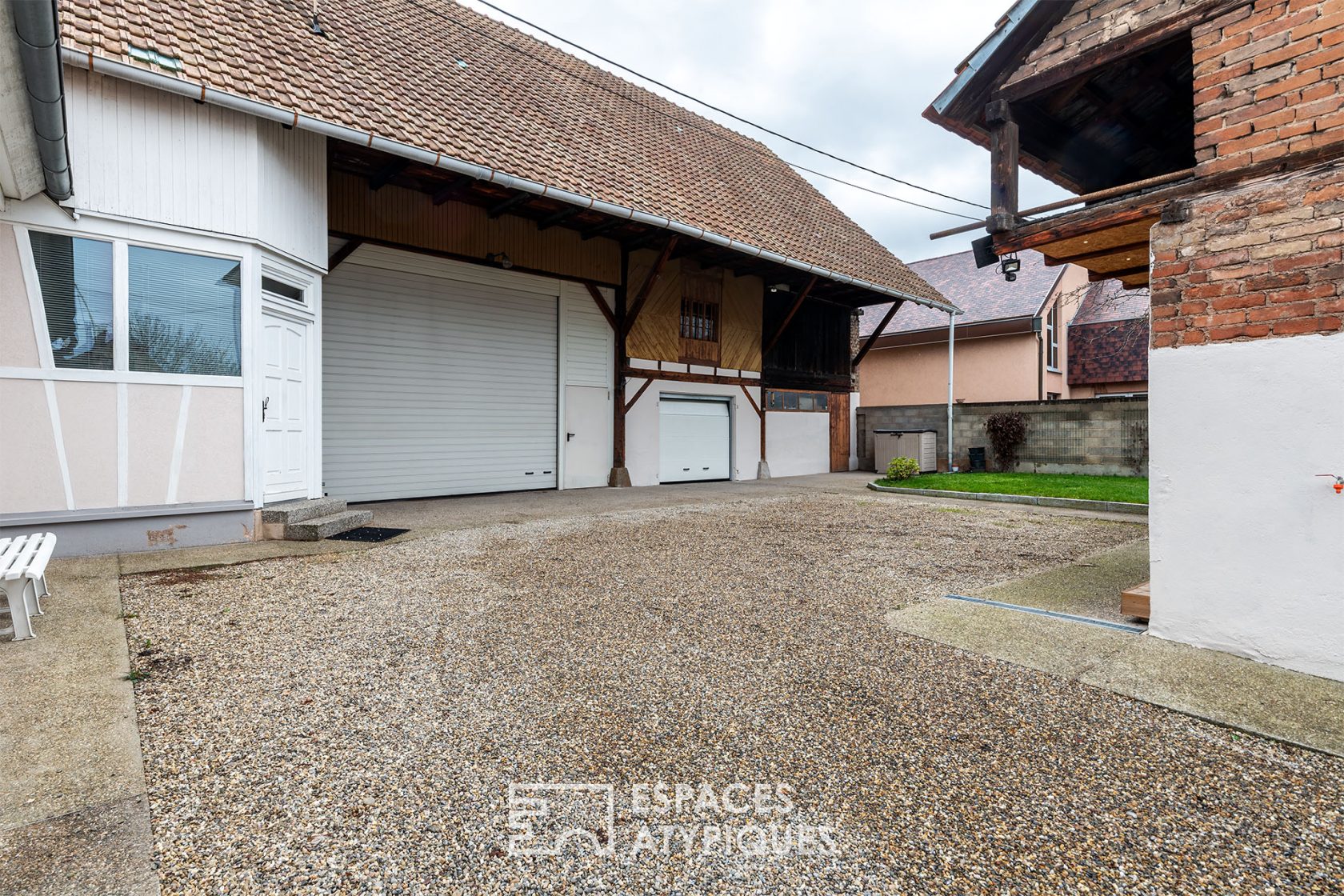 Old renovated farmhouse and its outbuildings