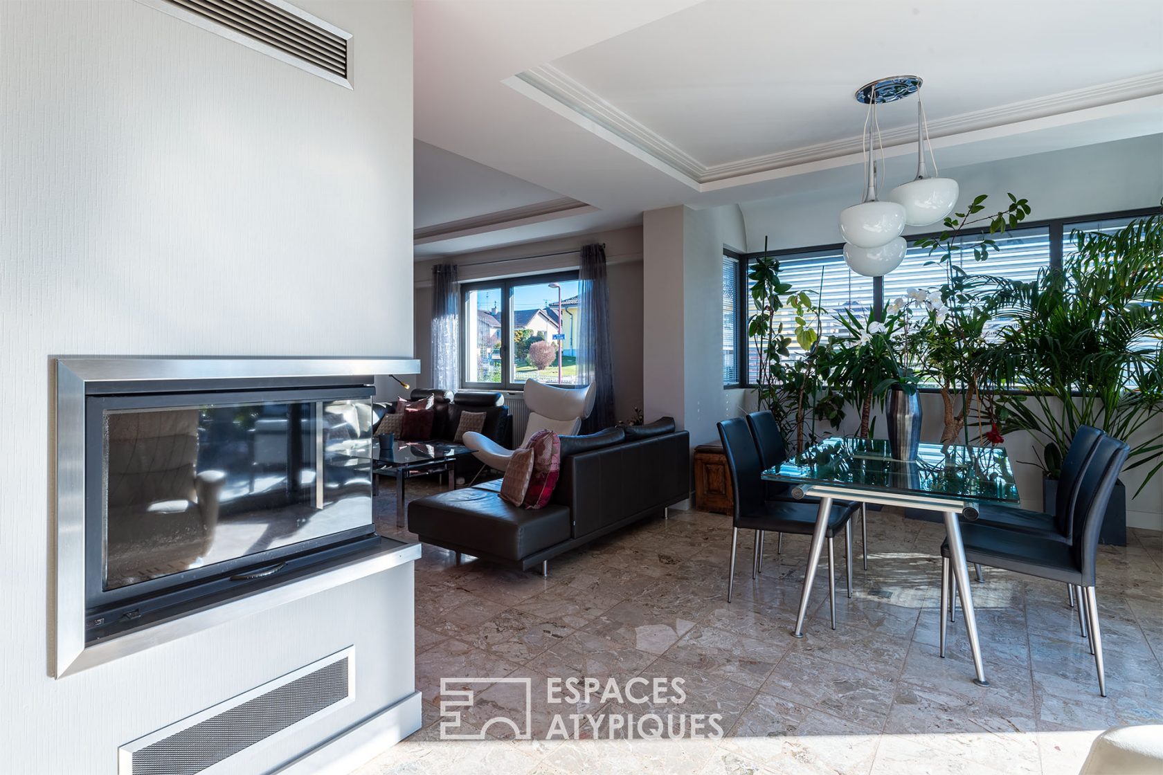Renovated house from the 70’s and its garden with trees