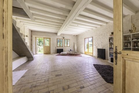 Former tack room converted into a dwelling and its three horse boxes.