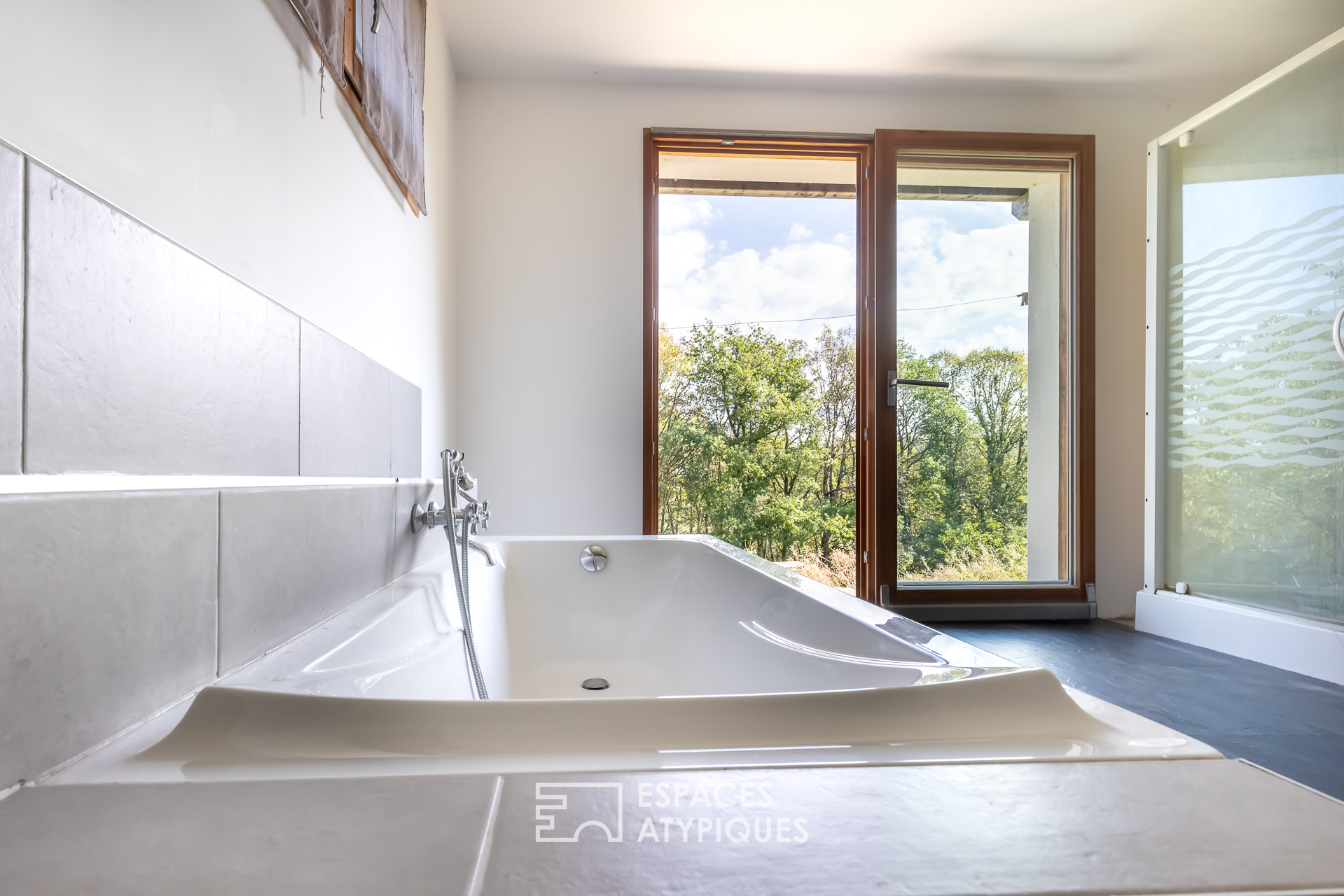 La maison en ossature bois en pleine harmonie avec la nature