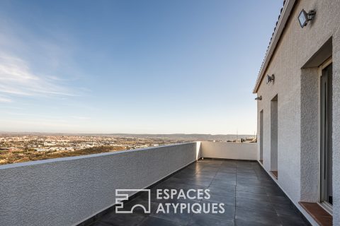 A balcony overlooking the city with its panoramic view