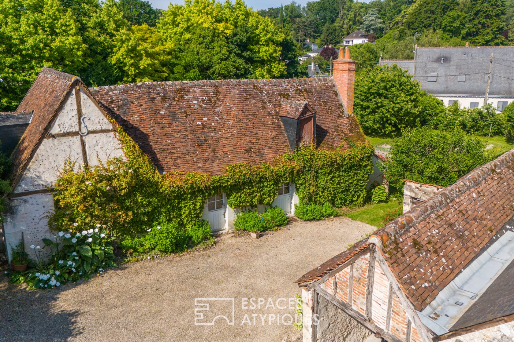 Historical property and its outbuildings with swimming pool.