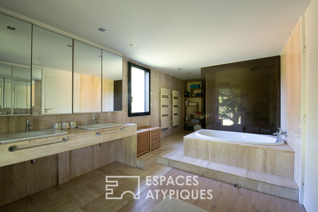 Large architect-designed waterfront house with park and swimming pool.