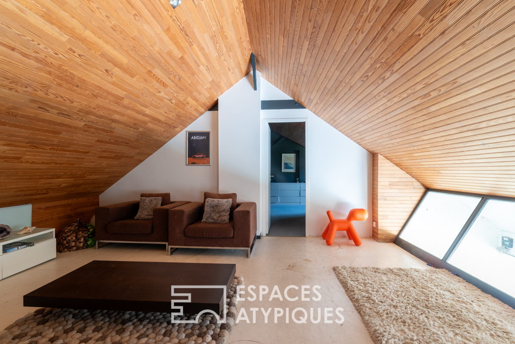 Large architect-designed waterfront house with park and swimming pool.