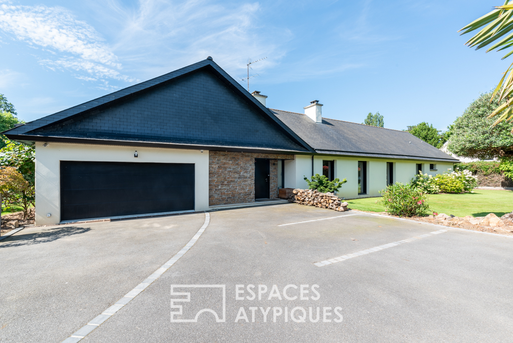 Large architect-designed waterfront house with park and swimming pool.