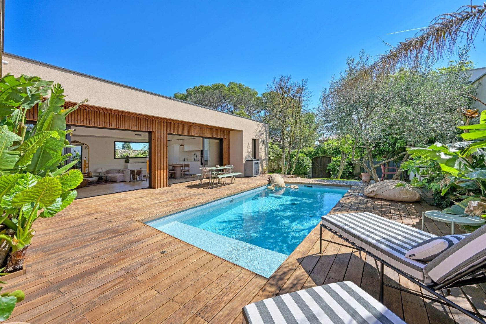 Elegant Single-Storey Wooden House with Swimming Pool and Green Garden at Tour Magne