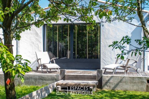 Maison de style industriel avec jacuzzi et terrasses