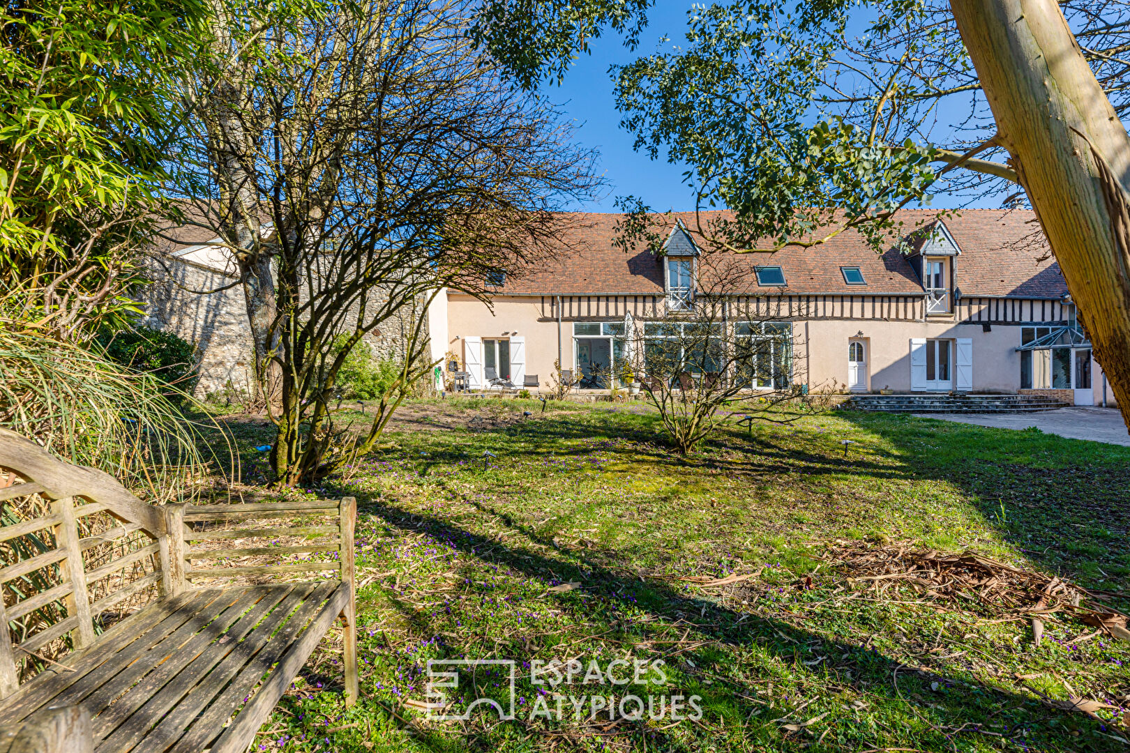 18th century farmhouse renovated into a family home with indoor swimming pool, terrace and garden in Attainville.