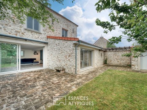 La maison meulière à la rénovation contemporaine avec atelier et jardin