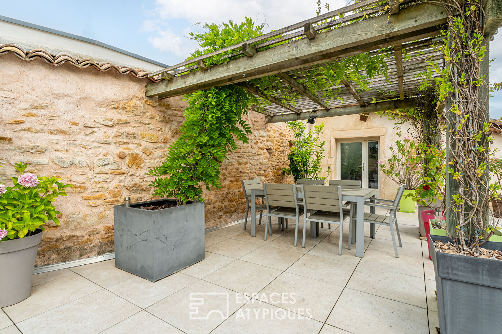 Golden stone house with roof terrace