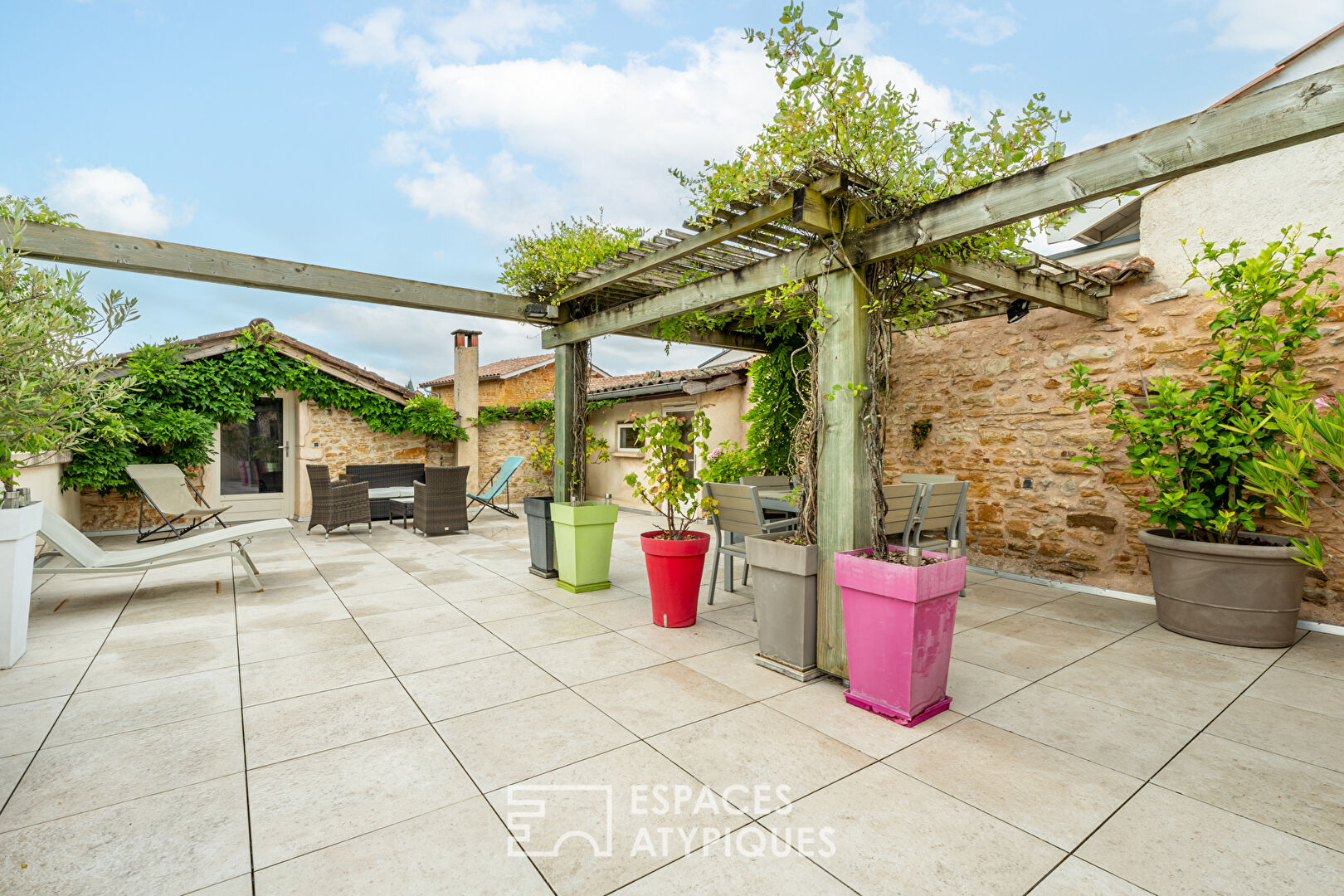 Golden stone house with roof terrace