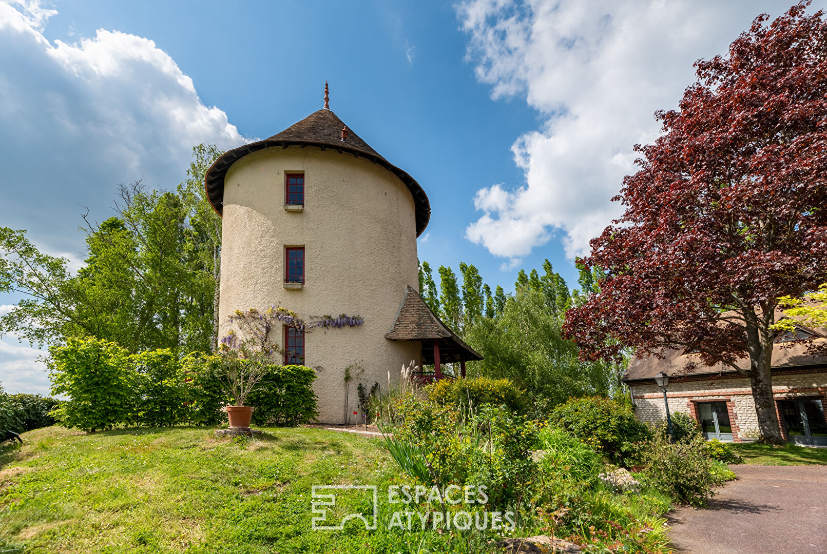 Old furnished mill in a green environment