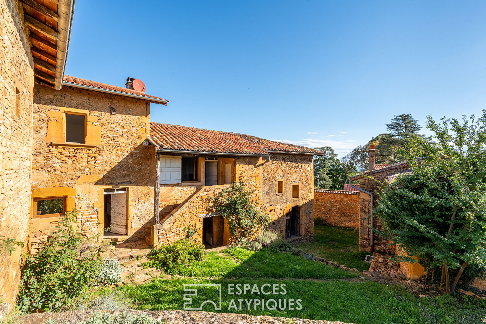 Golden stone house with great potential