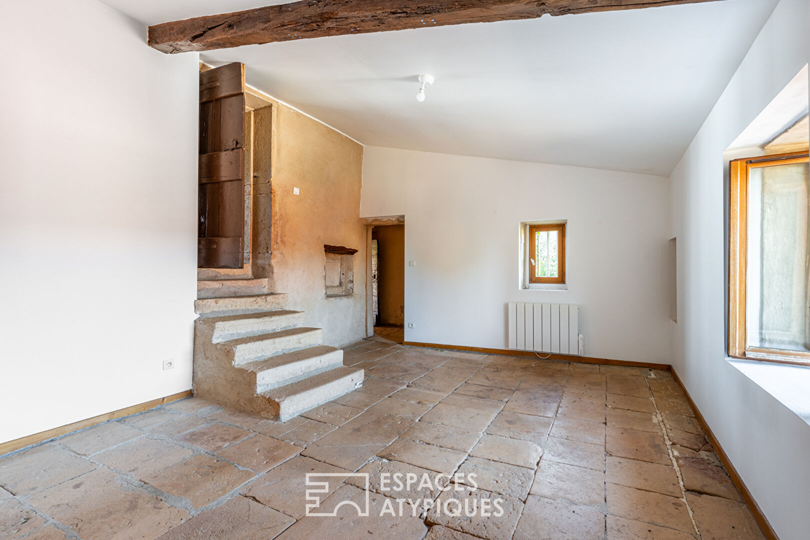 Golden stone house with great potential