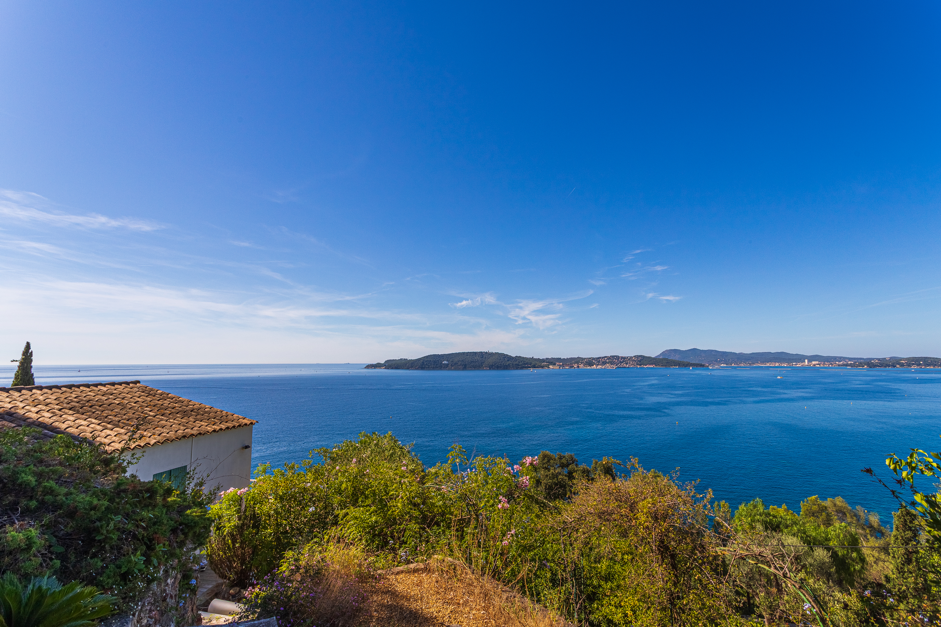 Set of two houses in a green park facing the sea