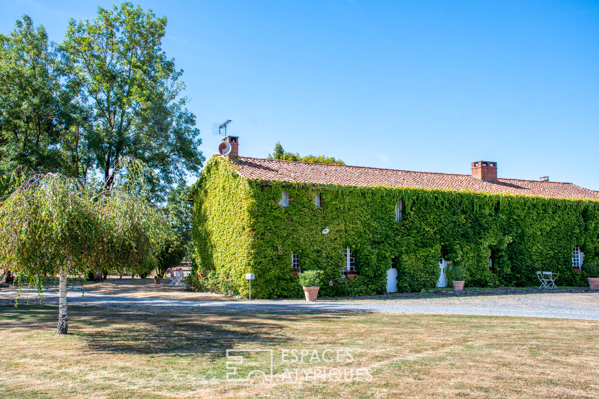Farmhouse with rustic charm and natural setting with outbuildings