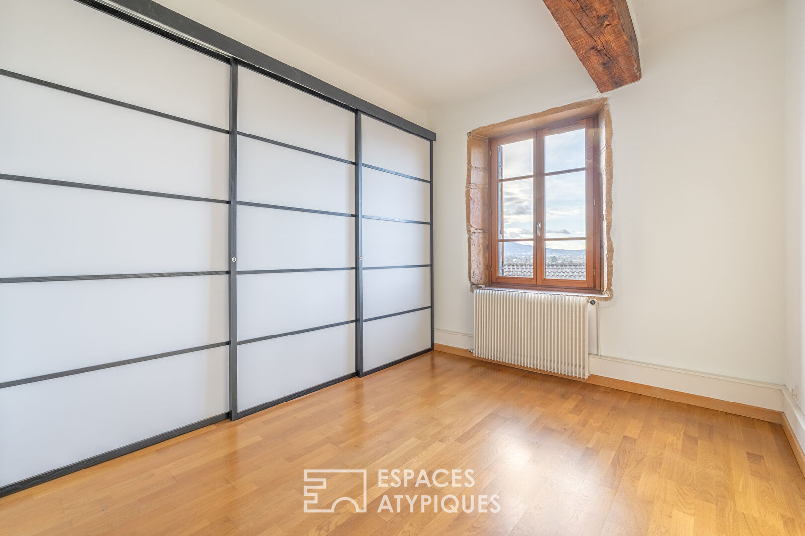 Charme historique et vue panoramique en dernier étage.