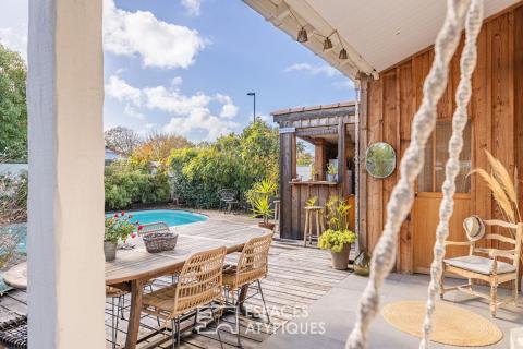 A renovated old farmhouse with a swimming pool and wooded garden