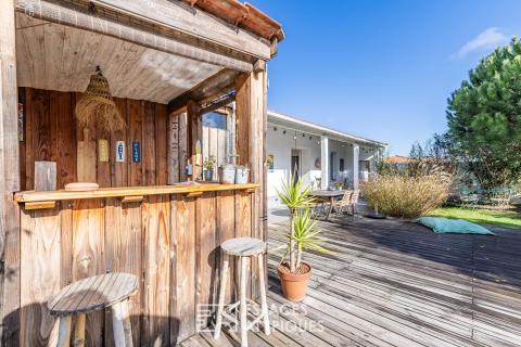 A renovated old farmhouse with a swimming pool and wooded garden