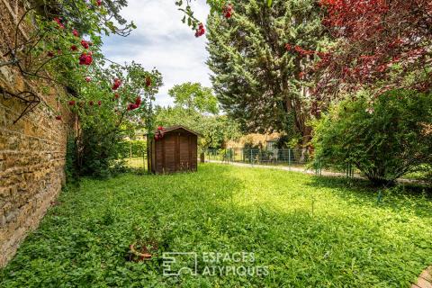Appartement ancien en plein centre avec jardin, caves et grenier