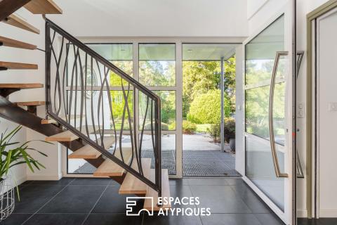 Large family home with a wooded garden
