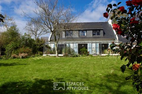 Maison familiale avec jardin d’hiver et jardin arboré