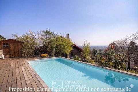 Timber frame house with view and swimming pool