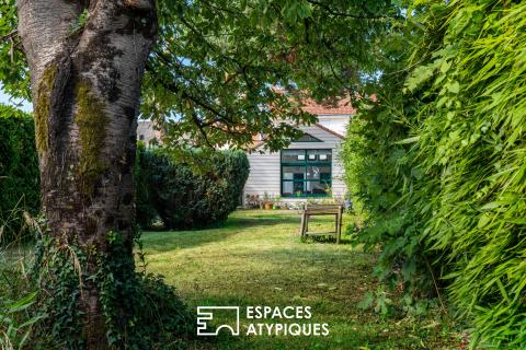 Basse-Indre : Charmante maison des années 30 au séjour cathédrale et joli jardin