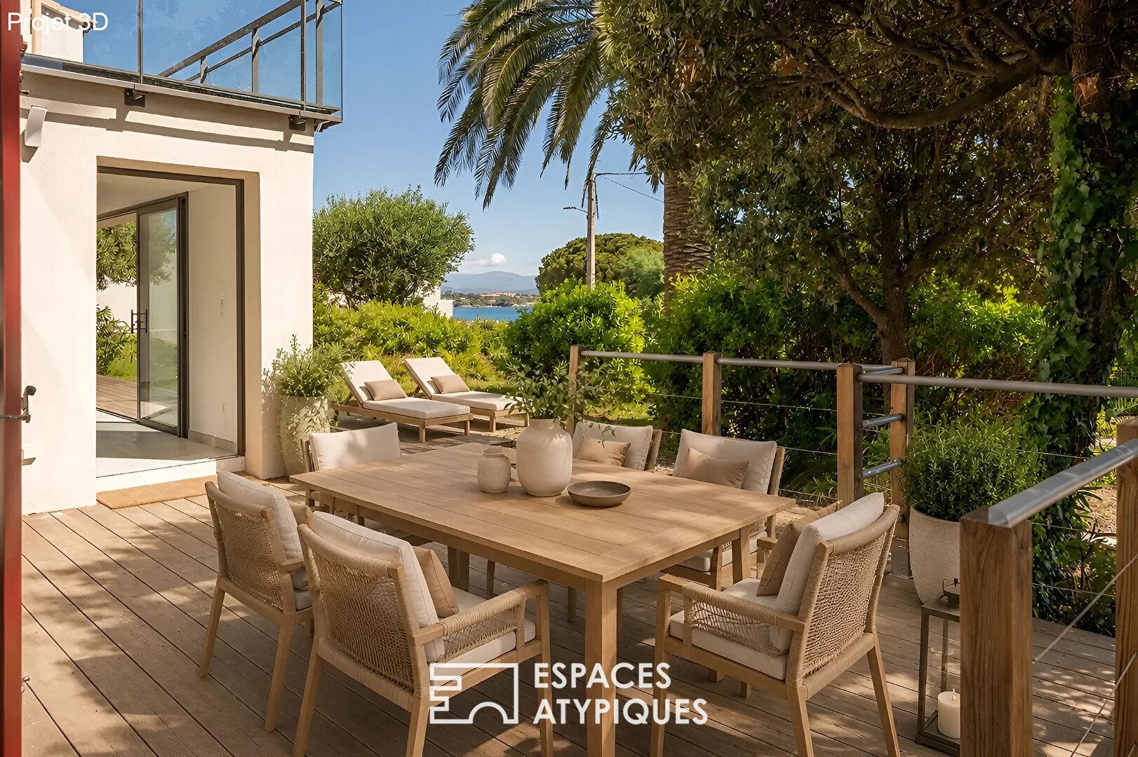 House-style apartment with terrace, swimming pool and partial sea view
