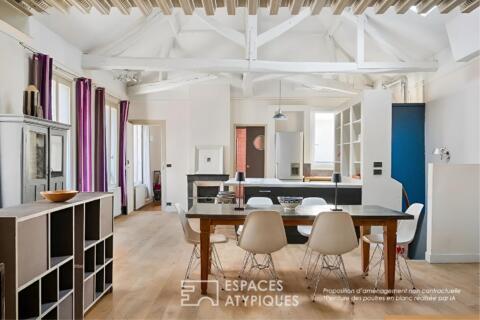 Loft on an upper floor with exposed beams in Batignolles