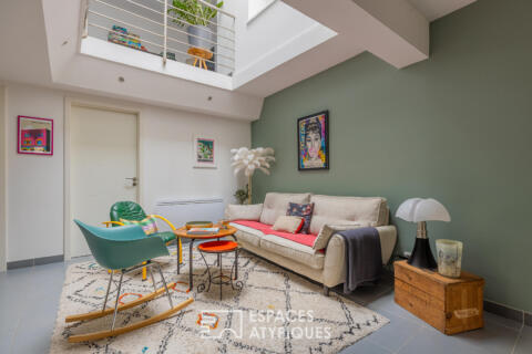 Duplex de caractère avec toit-terrasse à quelques pas de la gare