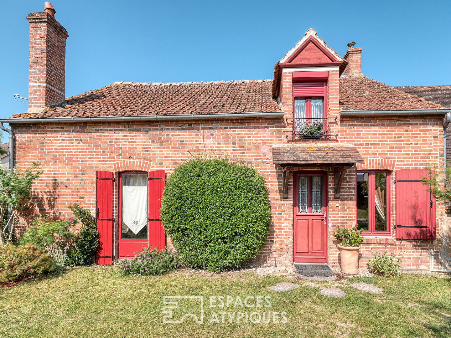 Typical brick house with bucolic garden