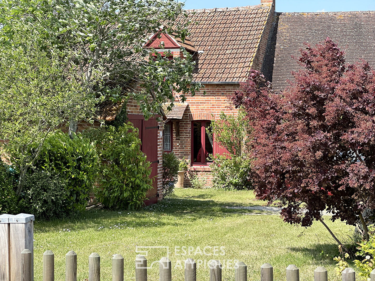 Typical brick house with bucolic garden