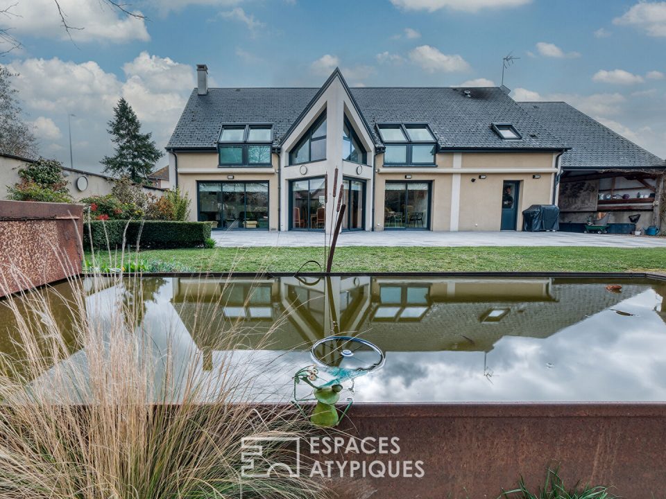 Maison contemporaine et son jardin paysagé