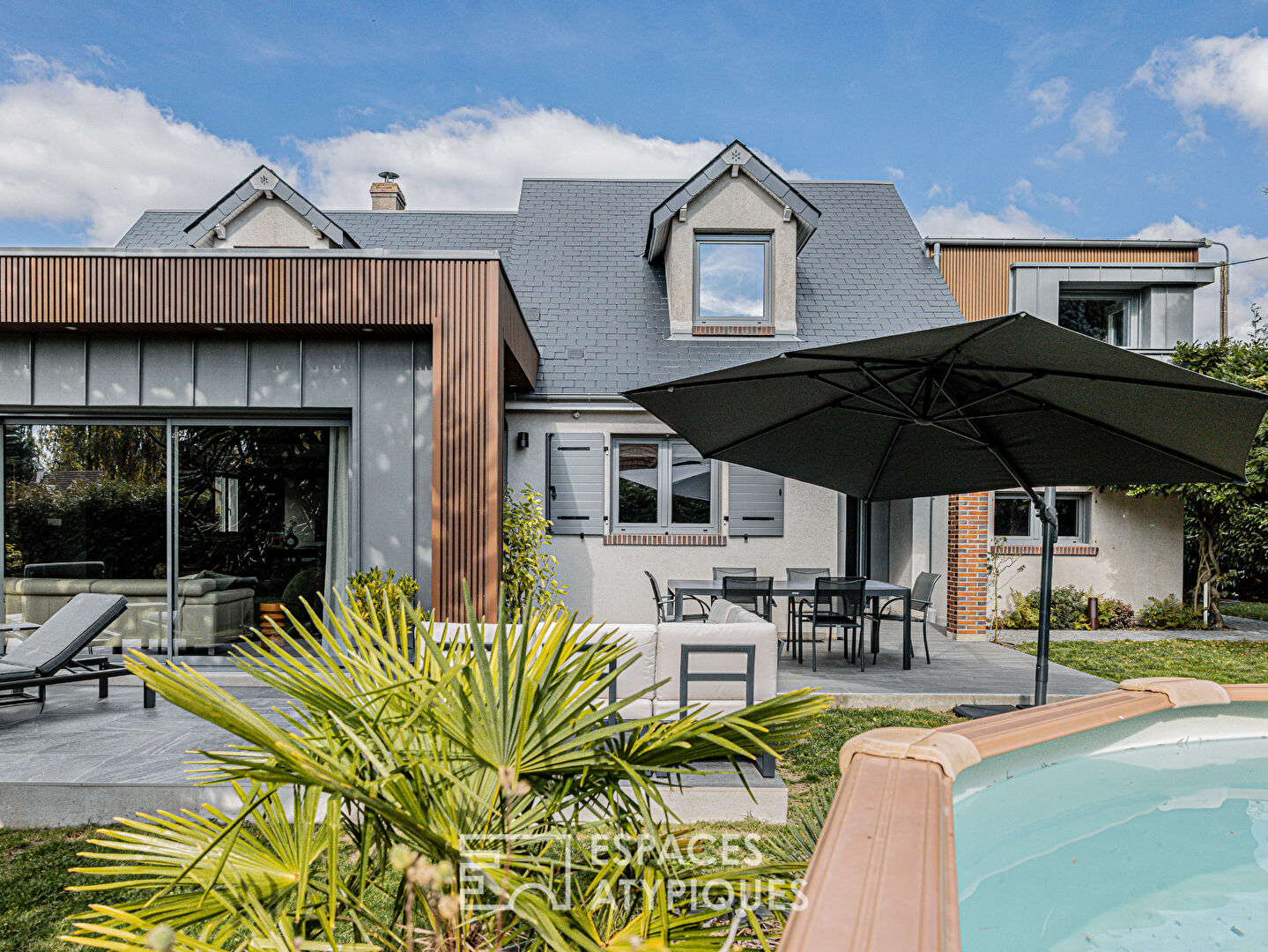 Renovated house with cubic extension, garden and swimming pool