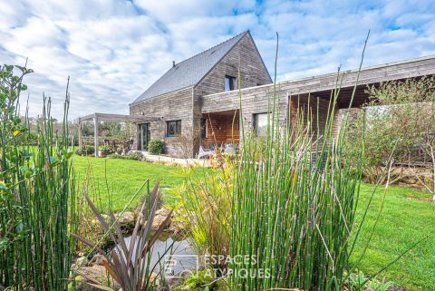 Chaleureuse maison en bois dans son écrin naturel