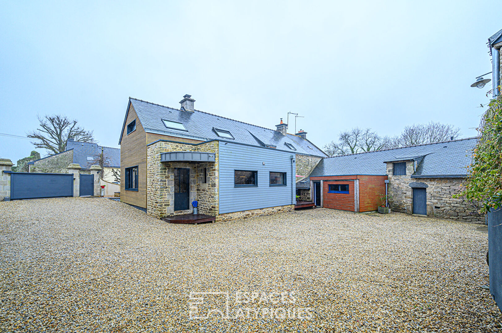 Renovated farmhouse and its outbuildings