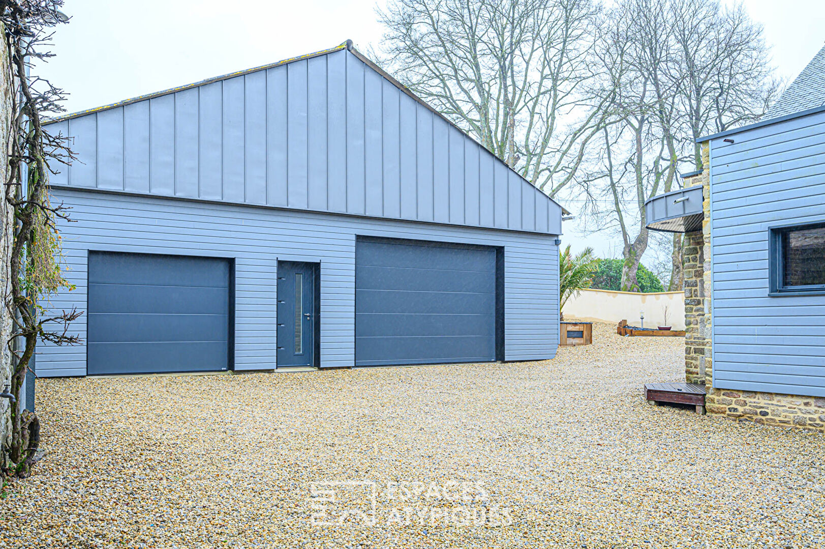 Renovated farmhouse and its outbuildings