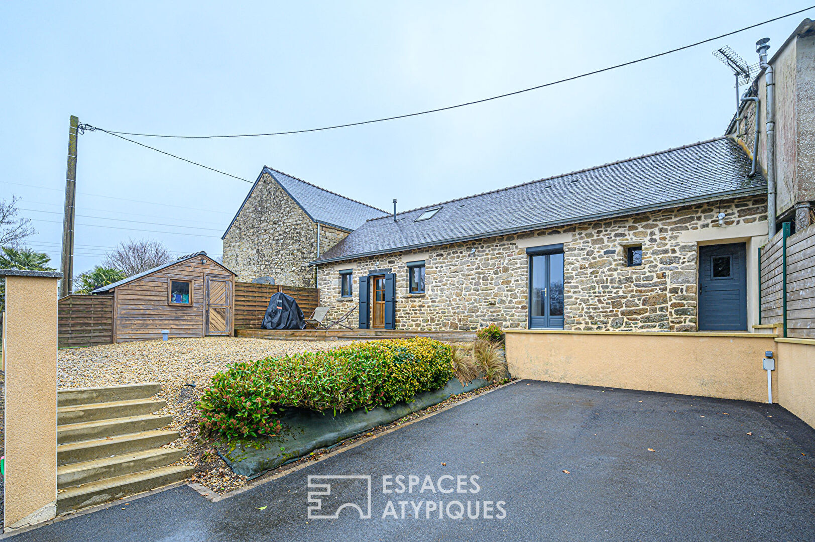 Renovated farmhouse and its outbuildings