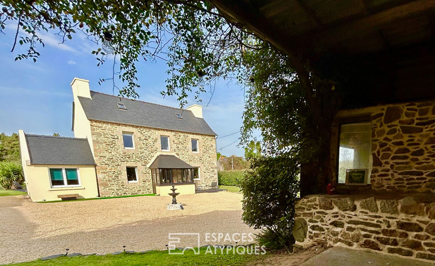 Renovated farmhouse with its stone outbuildings