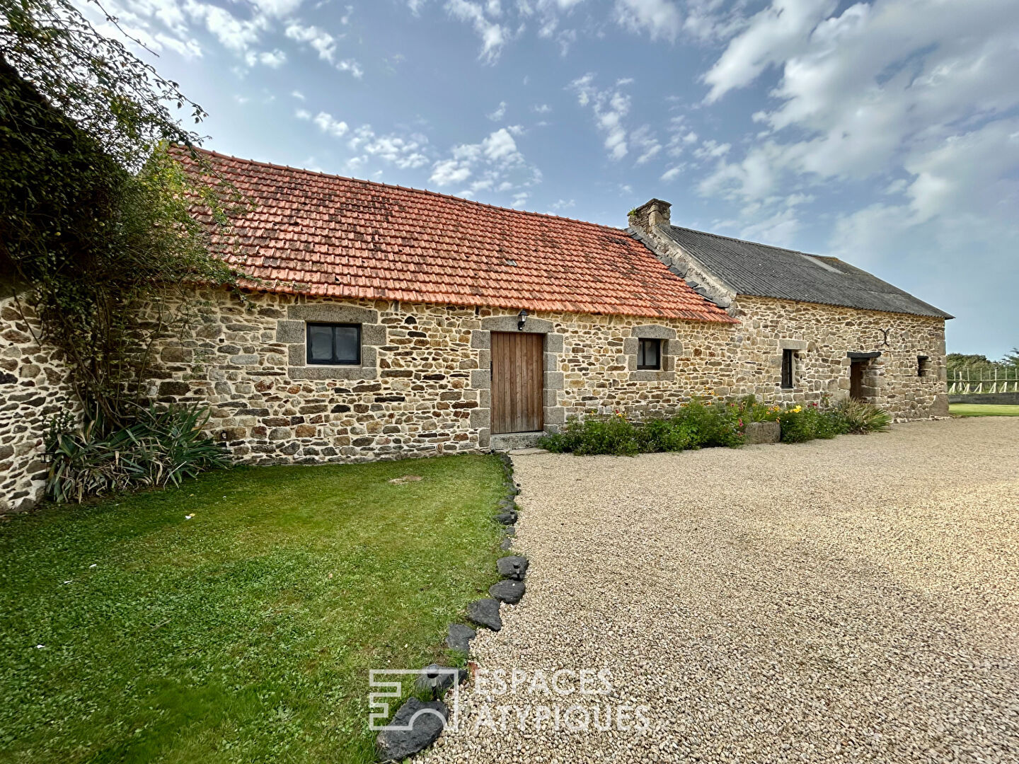 Renovated farmhouse with its stone outbuildings