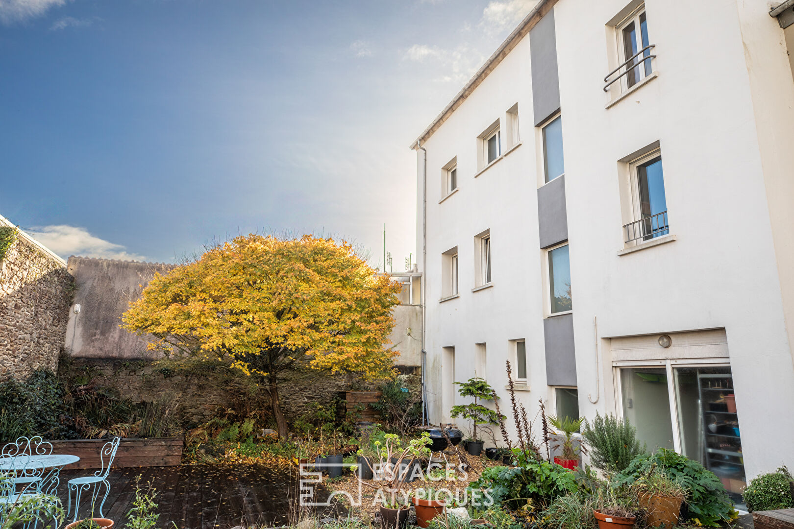 Esprit maison de ville : duplex atypique avec jardin partagé
