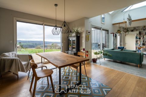 Maison contemporaine avec vue dégagée sur la rivière et la vallée