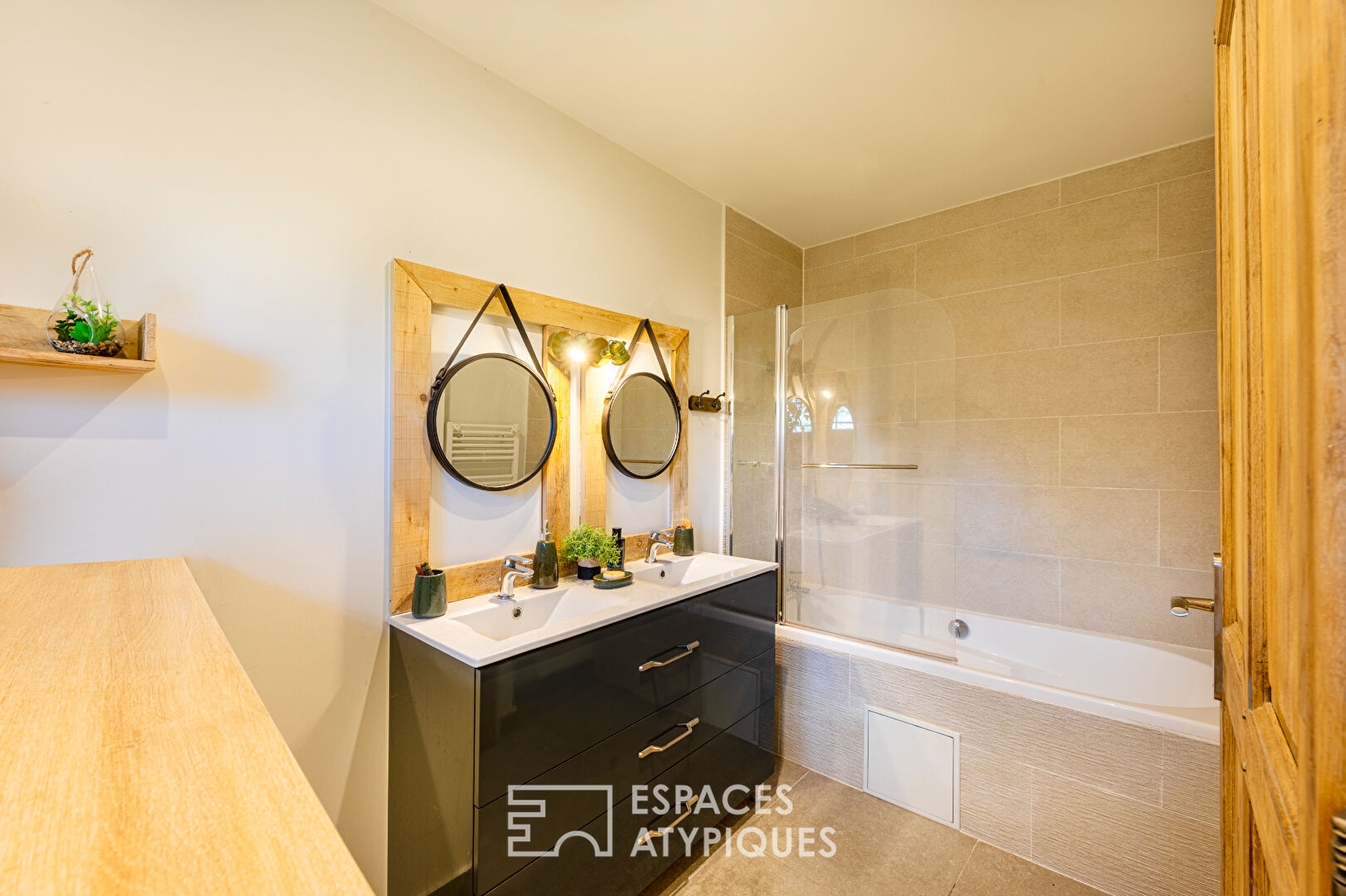 Completely renovated property, its outbuildings, and its wooded park.