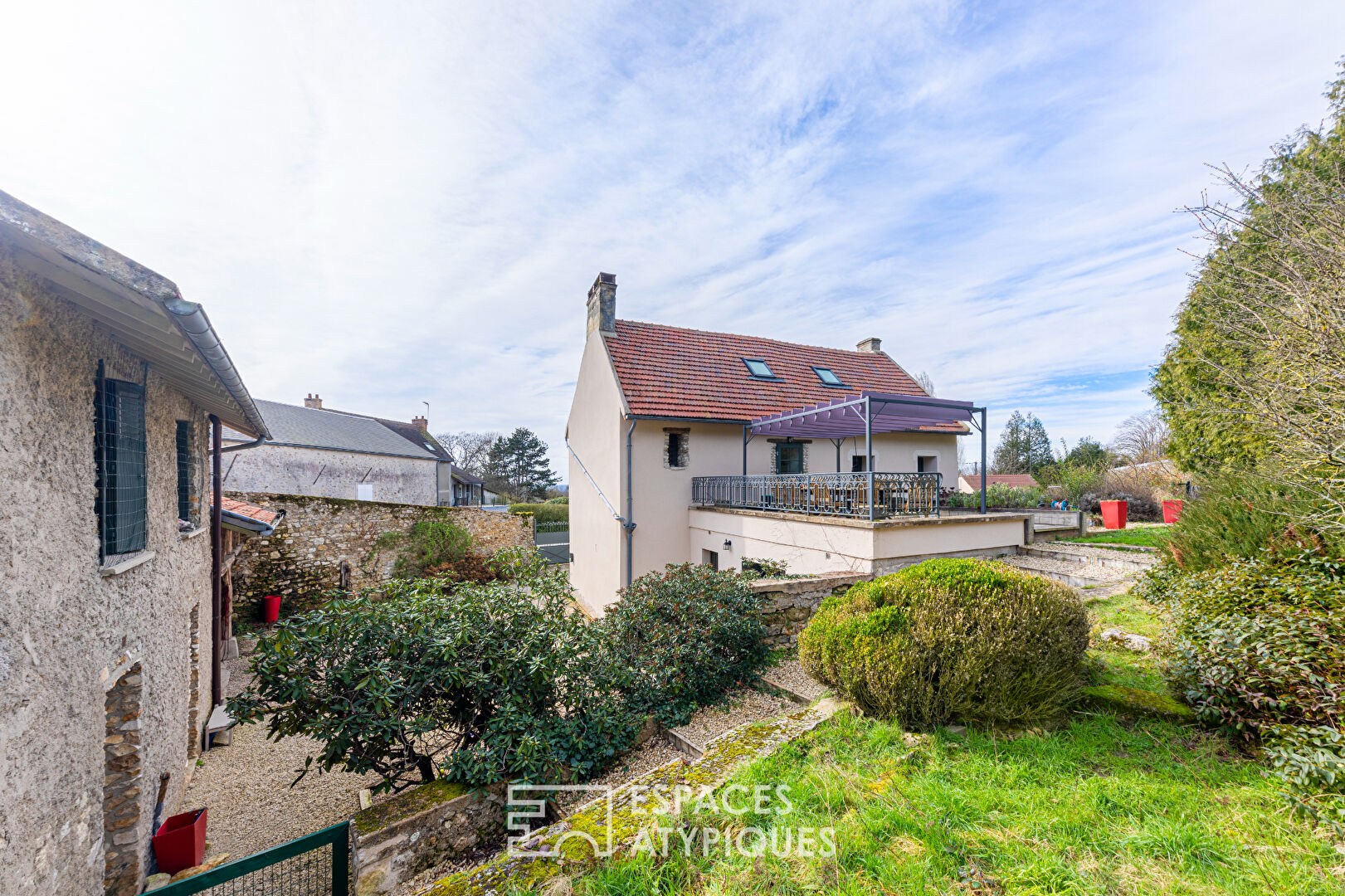 Completely renovated property, its outbuildings, and its wooded park.