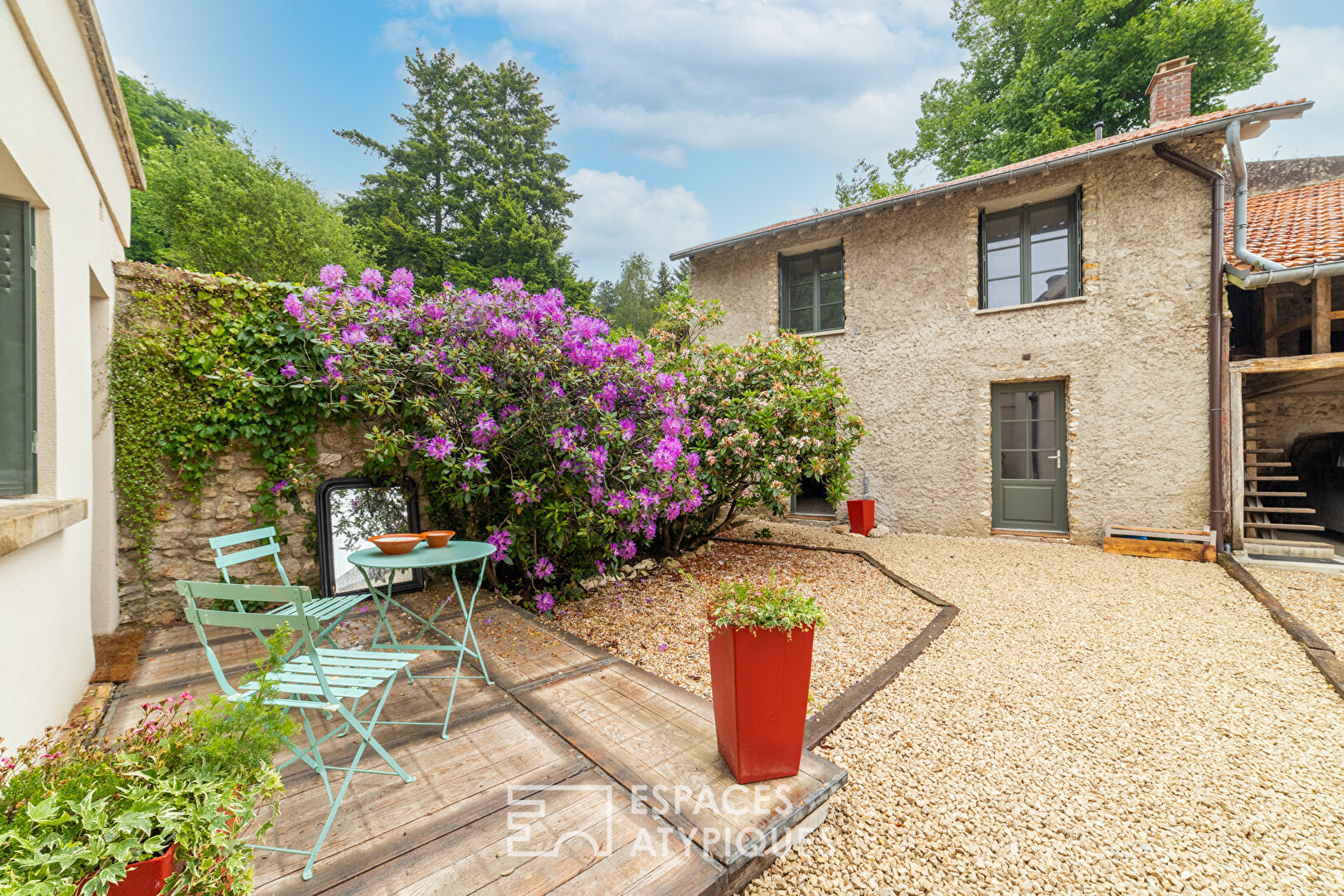 Completely renovated property, its outbuildings, and its wooded park.