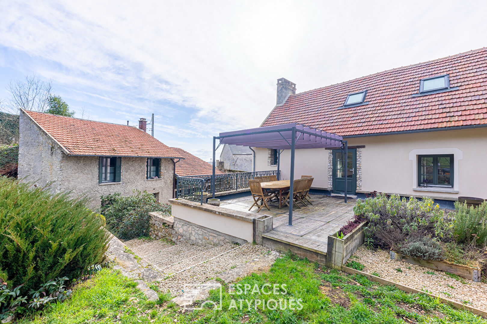 Completely renovated property, its outbuildings, and its wooded park.